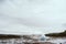 Stages of the eruption of the famous Strokkur Geyser In Iceland on a cold cloudy afternoon.