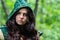 Staging photo of beautiful woman in fantasy suit with hood