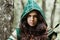 Staging photo of beautiful woman in fantasy suit with hood