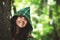 Staging photo of beautiful woman in fantasy suit with hood