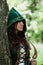 Staging photo of beautiful woman in fantasy suit with hood