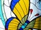 Stained Glass. Butterfly detail in colorful vitreaux backgound