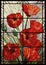 Stained glass flowers poppies on a light background in a geometric frame