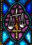 Stained Glass image of the Flaming Sword that guards Paradise and the Scales of Justice