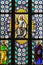 Stained Glass - Jesus holding the Holy Bible and saints