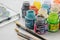 Stained glass paints Pebeo and paint brushes for artisan painting  on a glass surface.