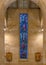 Stained glass window and the 10th and 11th of the Fourteen Stations of the Cross inside Christ the King Catholic Church in Dallas