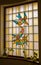 A stained glass window with bird design