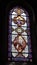 Stained glass window of Sanctuary of Our Lady of Lourdes in the Pyrenees, France