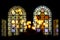 Stained glass windows in church and candles