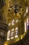 Stained glass windows, vaults, and lamp hanging in Malaga Cathedral, Spain