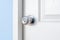 Stainless door knob or handle on wooden white door