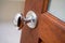 Stainless door knob on wood door