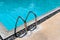 Stainless ladder handrail on swimming pool