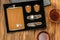 Stainless metal steel pocket flask gift hiking set for alcohol with glasses, fork, knife. glass of whiskey, cognac drink on wooden