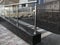 Stainless steel chrome plated finished hand rails with glass panels for an ramp or staircase steps for an building interiors for