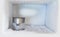Stainless steel drinking water glass in freezer