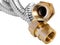 Stainless steel flexible hoses and flexi pipes, fittings and pressure joints close-up mackro. Industrial metal concept