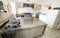 stainless steel kitchen with gas stove and an industrial meat slicer