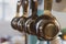 Stainless steel measuring cups hanging in a kitchen