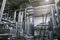 Stainless steel pipes and reservoirs or tanks, industrial beer production, metal pipeline in brewery fermentation and distillation