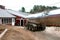 Stainless steel tankers ready to load milk from a dairy farm