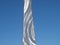 A Stainless Steel Upright Against Blue Sky