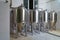 A stainless steel vat in the food industry at a brewery in the process of brewing beer. Background