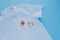 Stains from fresh tomatoes on a white shirt.isolated.on a blue background.top view
