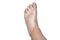 Stains from vitiligo disease on the left foot in a young Caucasian woman, isolated on a white background with a clipping path.