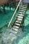 Stair down to crystal clear ocean from water villa private balcony, Maldive