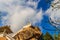 Stair way upward to the golden pagoda on the hill with blue sky background at Wat Khao Rup Chang or Temple of the Elephant Hill, o