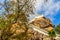 Stair way upward to the golden pagoda on the hill with blue sky background at Wat Khao Rup Chang or Temple of the Elephant Hill, o