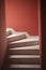 Staircase covered with tiles in the corridor of the house