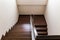 Staircase custom built home interior with wood staircase and white wal