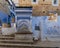 Staircase, fountain, baskets &tile painting in Chefchaouen, a city in northwest Morocco noted for its buildings in blue shades.