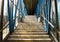 Staircase in a glass cage Bridge connecting two buildings Marble floor