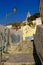 Staircase with graffiti and lantern in the narrow streets of Lisbon