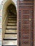 Staircase with its colorful door in the riad of Marrakech Medina in Morocco
