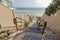 Staircase in the middle of beach houses' beige fences at Carlsbad, California