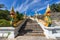 Staircase with Naga snakes to Wat Kaew Korawaram white temple in Krabi Town in Thailand