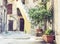 Staircase and plants in tubs in the courtyard of the house in Catania, Sicily, Italy