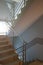 Staircase with stainless steel handrails in a modern high-rise building. The interior of modern buildings. Rise to the top of the