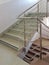 Staircase with stainless steel handrails in a modern high-rise building. The interior of modern buildings. Rise to the top of the