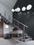 Staircase to the second floor in a modern apartment with metal railings and wooden steps with large pendant lamps, black and white