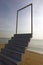 Stairs with abstract open door. steps, stairway to the sky. Dream, exit and success concept. beach background.