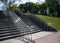 Stairs with concrete steps and shiny metal railings