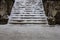 Stairs covered with fresh snow. Danger of accident on snow-covered slippery steps