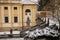 Stairs with cupid statues near baroque pilgrim place, Loreto Monastery, facade of Prazska Loreta Church, Hradcany district, snow