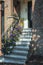 Stairs decorated with petunias to the front door of a house in t